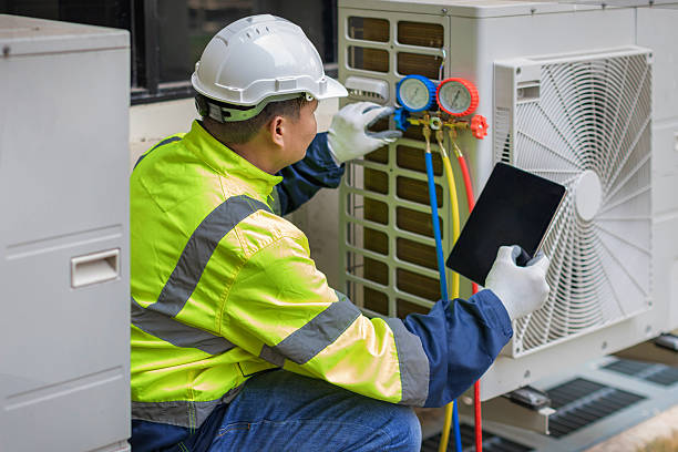 Professional Air Conditioning Repair technician working in Pleasantville, IA